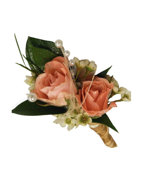 Pink spray roses, glittered leaves, waxflower, and ribbon accents.