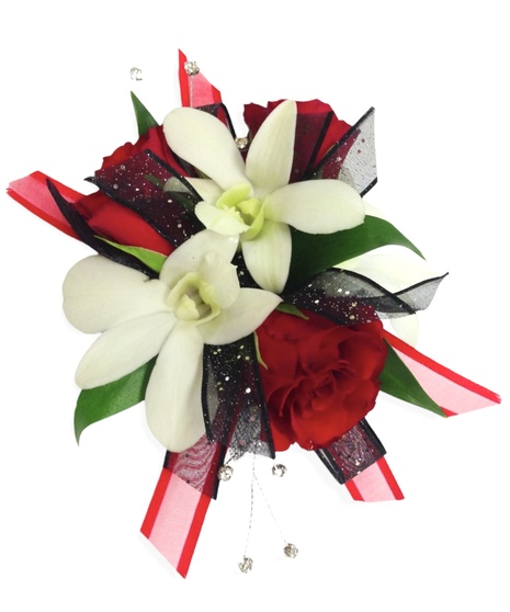 Red spray roses with white dendrobium orchids accented with greens, ribbon, and rhinestones