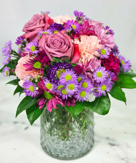 Purple Rain, is an all purple flower vase arrangement with roses and daisies
