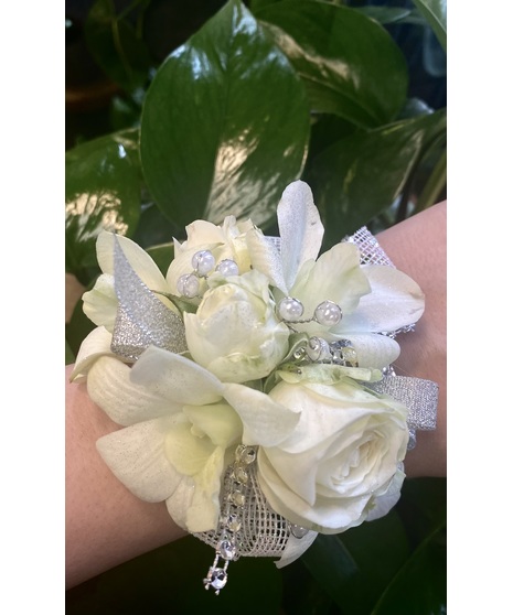 Wrist Corsage of variegated fuchsia Dendrobium Orchids, with accent blooms, ribbon layers, beads and feathers. Add an optional keepsake jewelry band