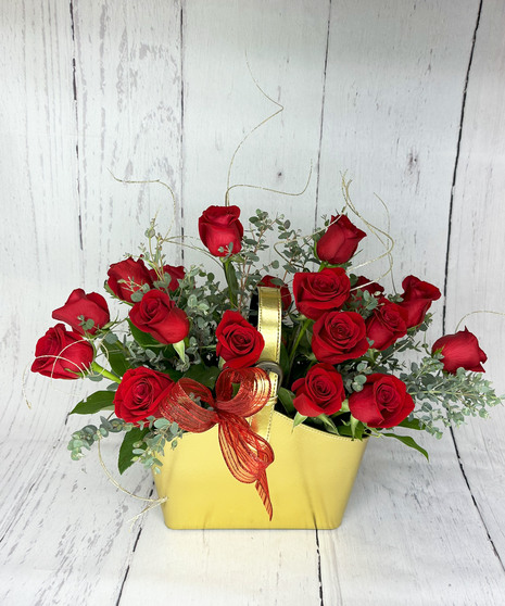 red roses in gold handbag