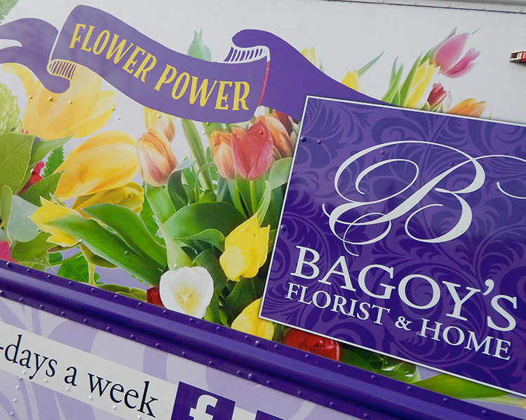 A vehicle wrap promotes flower power on one of our delivery trucks